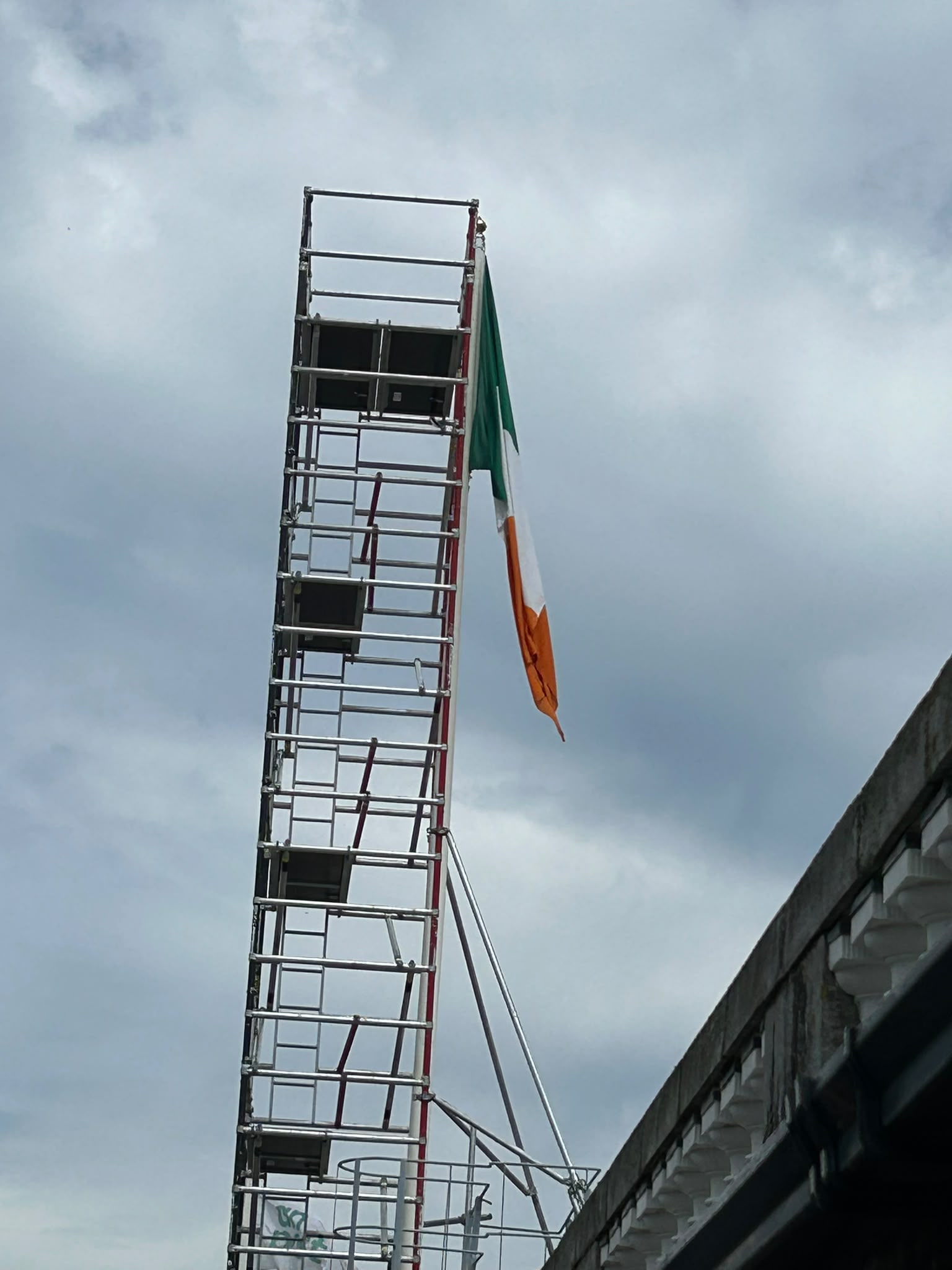 Flagpole repair on the GPO roof